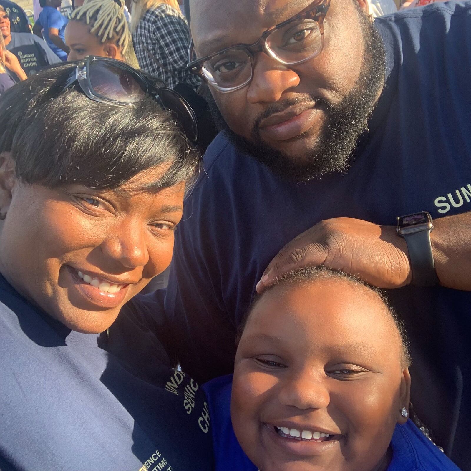 Ryleigh Manuel of Trotwood landed a space next to Kanye West during his Sunday Service  on Aug. 25, 2019 at RiverScape MetroPark for Dayton mass shooting.  She is pictured her with her mom and dad, Kelly Watts and Trae Manuel.