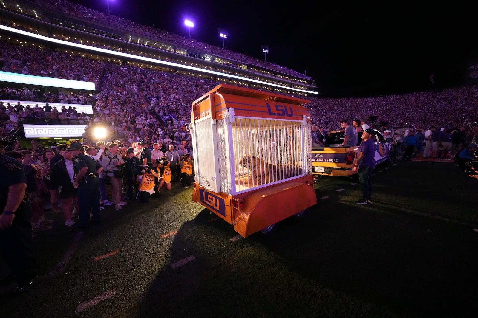 A live tiger is rolled into Tiger Stadium before an NCAA college football game between LSU and Alabama in Baton Rouge, La., Saturday, Nov. 9, 2024. (AP Photo/Gerald Herbert)