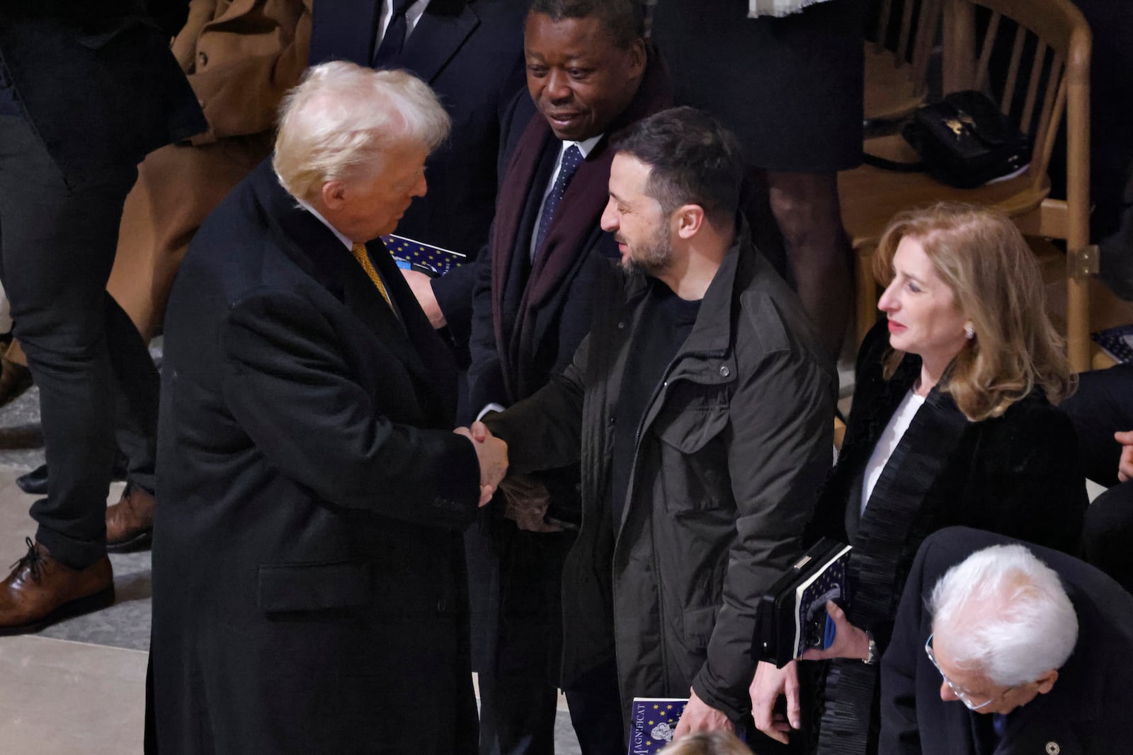 President-elect Donald Trump shakes hands with Ukraine's President Volodymyr Zelenskyy in Notre Dame Cathedral as France's iconic cathedral is formally reopening its doors for the first time since a devastating fire nearly destroyed the 861-year-old landmark in 2019, Saturday Dec.7, 2024 in Paris ( Ludovic Marin, Pool via AP)