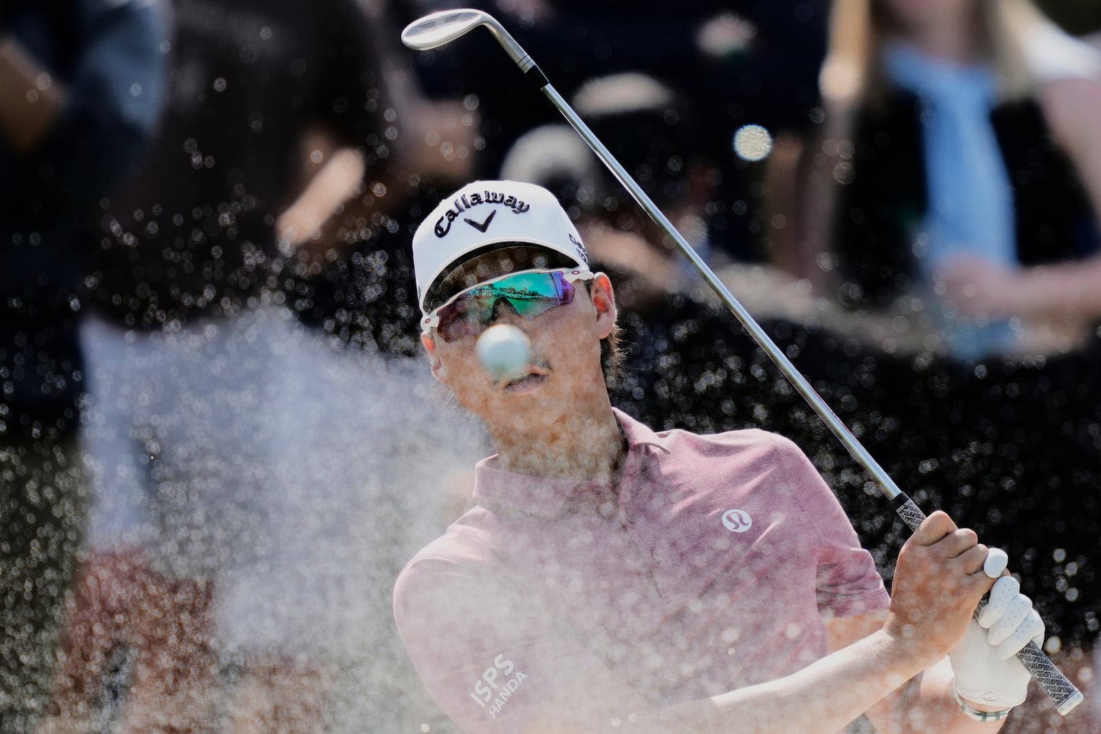 Min Woo Lee hits out of a bunker on the fourth hole during the third round of The Players Championship golf tournament Saturday, March 15, 2025, in Ponte Vedra Beach, Fla. (AP Photo/Julia Demaree Nikhinson)