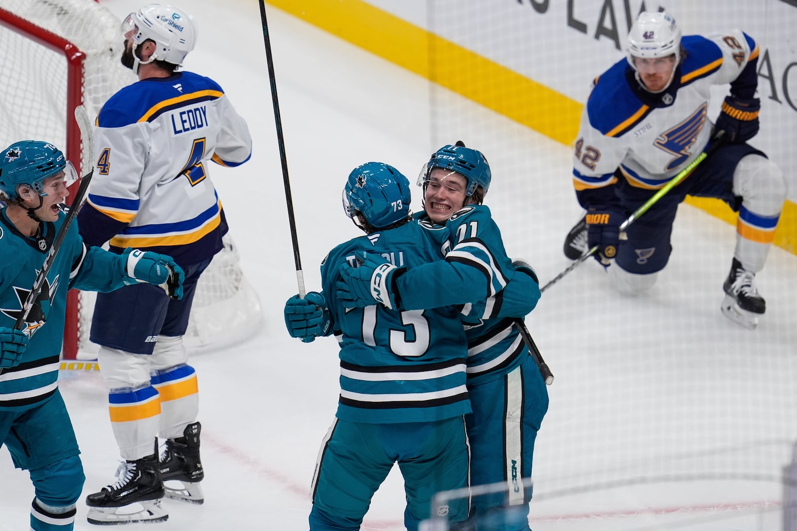 San Jose Sharks center Tyler Toffoli (73) is congratulated by center Macklin Celebrini (71) after his goal against the St. Louis Blues during the first period of an NHL hockey game Thursday, Oct. 10, 2024, in San Jose, Calif. (AP Photo/Godofredo A. Vásquez)