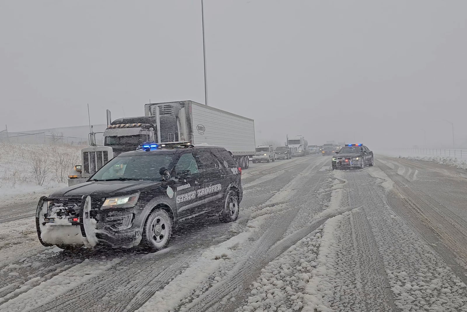 This image provided by Nebraska State Patrol shows vehicles stopped on the highway during blizzard near Gretna, Neb., on Wednesday, March 19, 2025. (Nebraska State Patrol via AP)