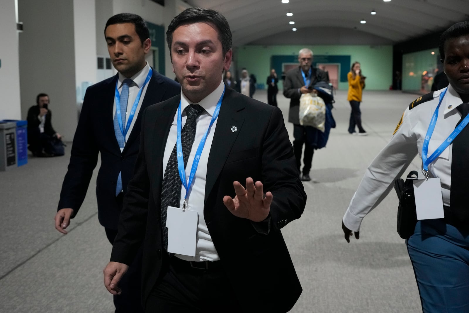 Yalchin Rafiyev, Azerbaijan's COP29 lead negotiator, gestures as he walks through the COP29 U.N. Climate Summit, Saturday, Nov. 23, 2024, in Baku, Azerbaijan. (AP Photo/Rafiq Maqbool)