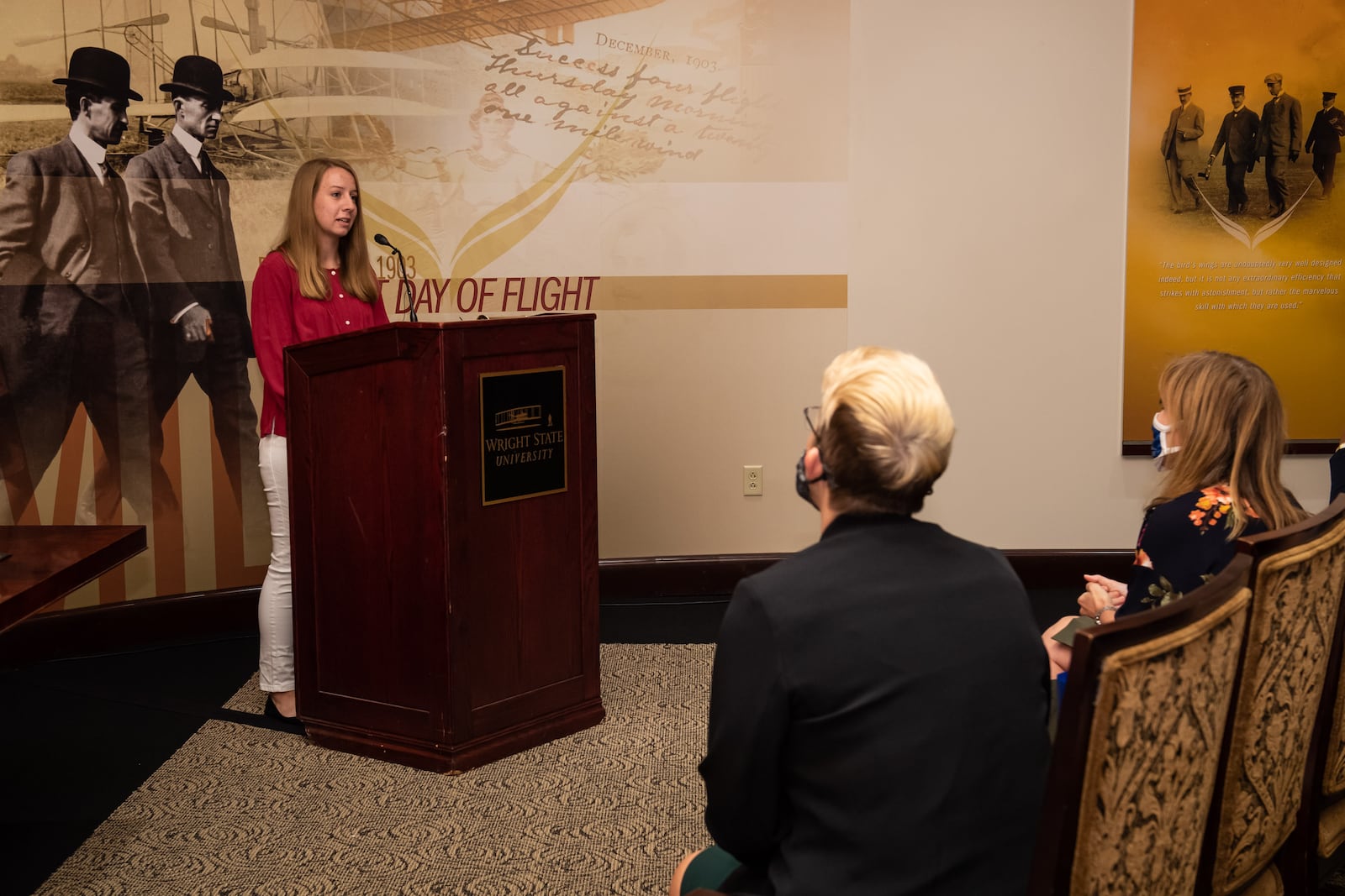 Wright State president Sue Edwards and Clark State president Jo Blondin listen to Gracie Northington, a junior finance major at Wright State who earned her associate’s degree through Clark State and transferred to Wright State to pursue a bachelor’s degree in finance, at the ceremony to renew Clark State and Wright State’s partnership. CONTRIBUTED BY WRIGHT STATE