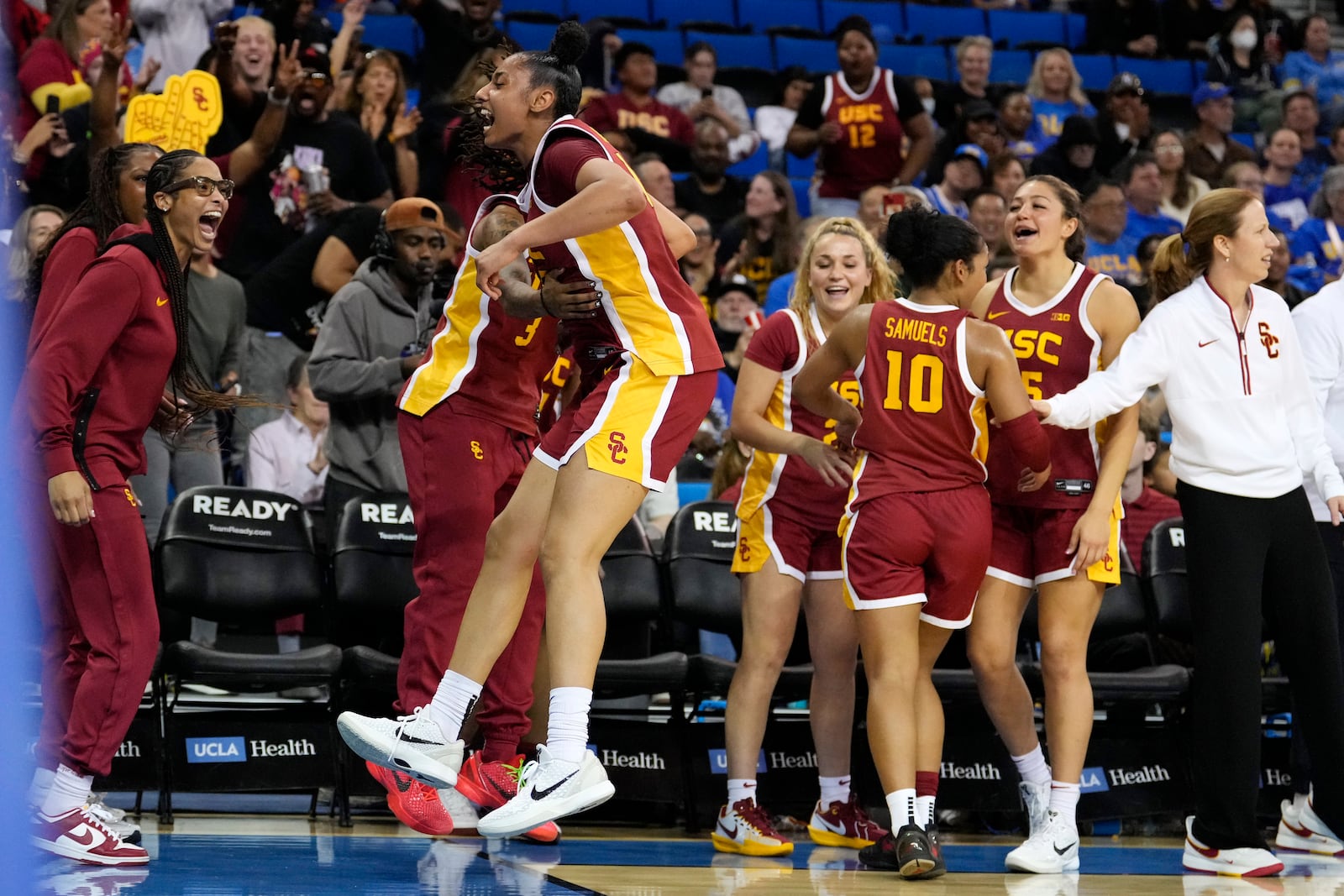 Southern California guard JuJu Watkins, center, celebrates with teammates during the second half of an NCAA college basketball game against UCLA Saturday, March 1, 2025, in Los Angeles. (AP Photo/Mark J. Terrill)