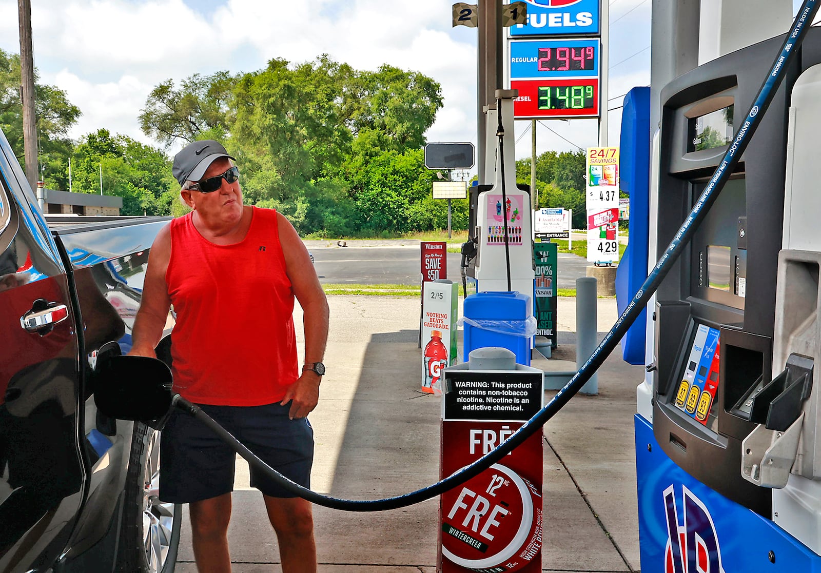 Andrew Wilt said he wasn't planning on getting gas but when he saw how low it was at VP Racing Fuels in Enon, he had to stop Friday, July 7, 2023. BILL LACKEY/STAFF