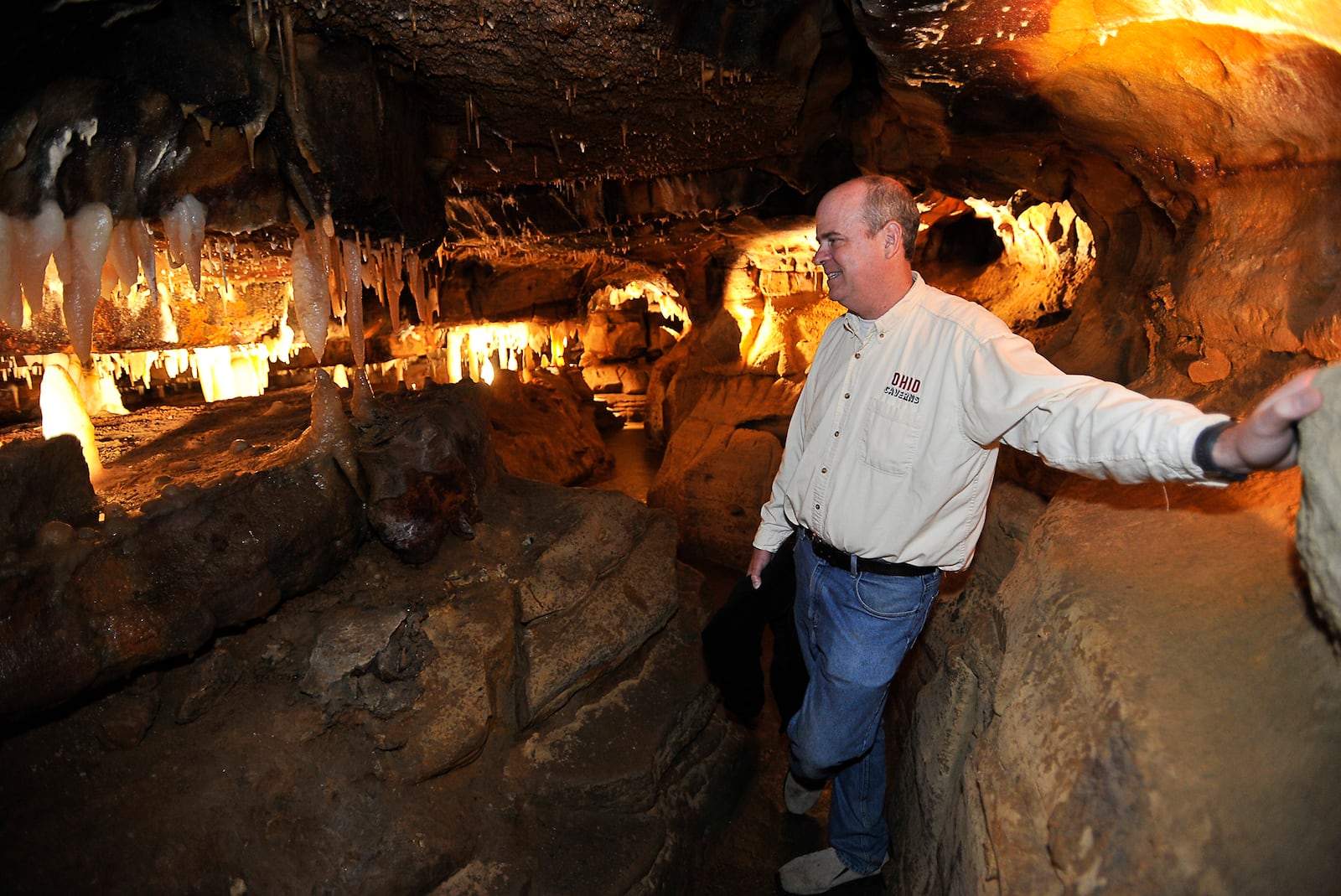 Eric Evans, owner of Ohio Caverns in Champaign County, talks about the new section of the caves that includes a handicapped accessible area wide enough for a wheelchair to fit through.  Staff photo by Bill Lackey