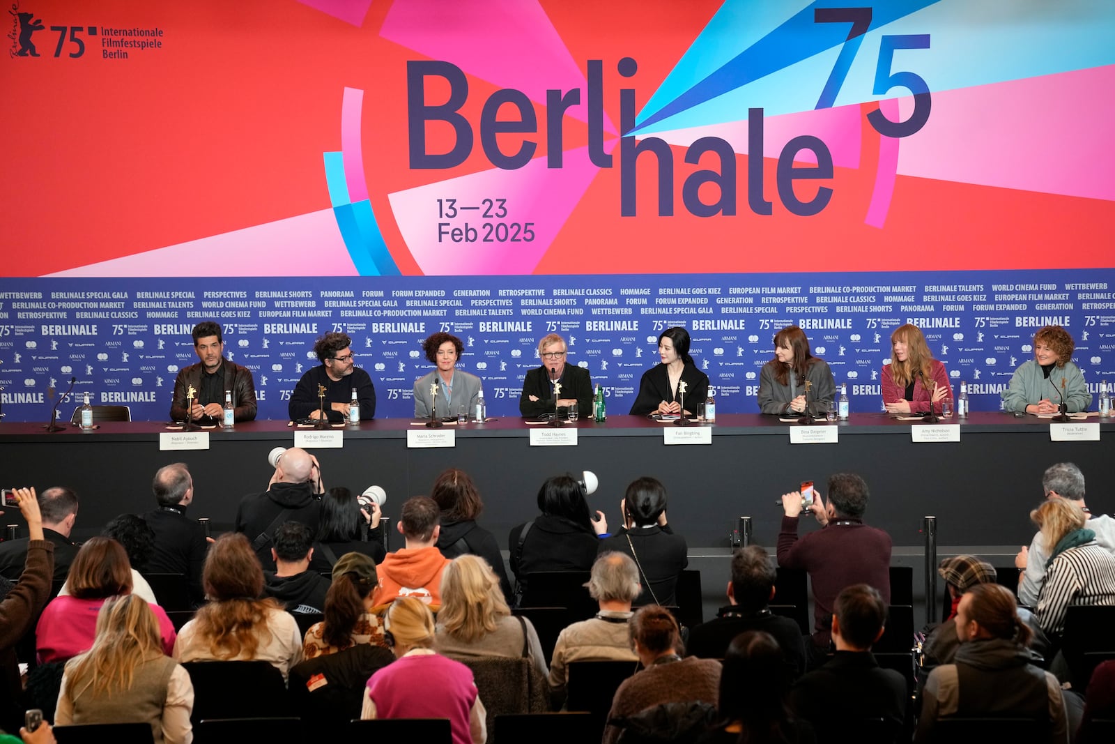 The Film Festival, Berlinale International Jury from left, Nabil Ayouch, Rodrigo Moreno, Maria Schrader, Todd Haynes, Fan Bingbing, Bina Daigeler, Amy Nicholson and the festival Director Tricia Tuttle attend a news conference at the opening day of International Film Festival, Berlinale, in Berlin, Thursday, Feb. 13, 2025. (AP Photo/Ebrahim Noroozi)