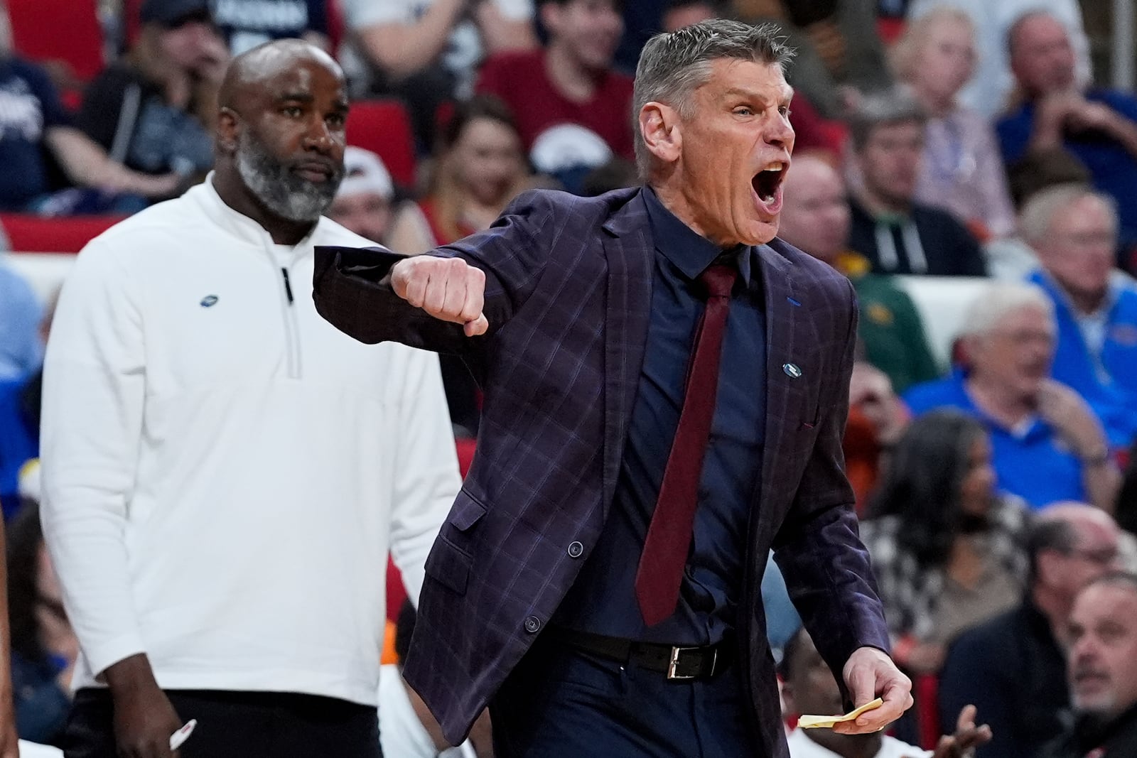 Oklahoma head coach Porter Moser reacts during the first half in the first round of the NCAA college basketball tournament against UConn, Friday, March 21, 2025, in Raleigh, N.C. (AP Photo/Stephanie Scarbrough)