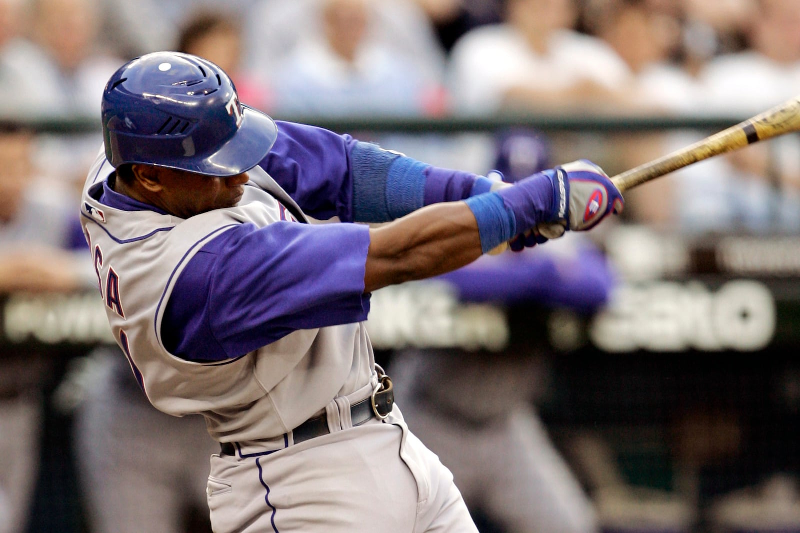 FILE - Texas Rangers' Sammy Sosa singles against the Seattle Mariners in the fourth inning at a baseball game, Thursday, May 31, 2007, in Seattle. (AP Photo/Elaine Thompson, File)