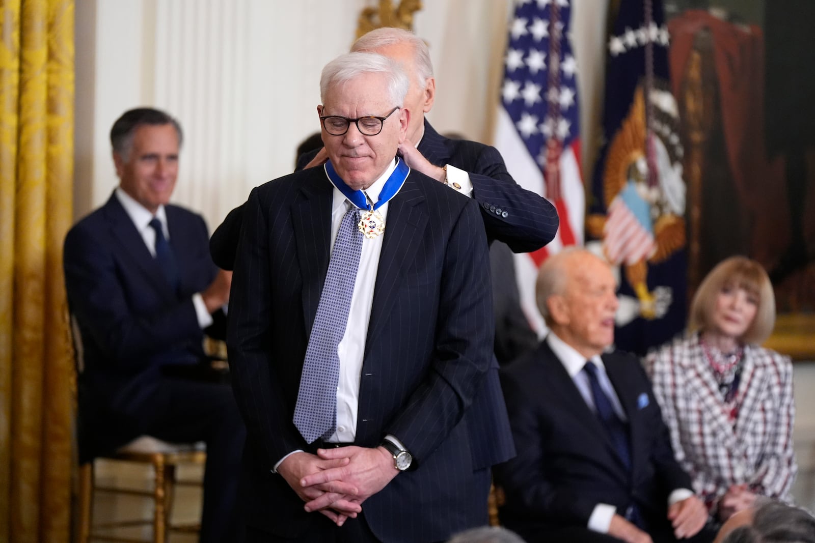 President Joe Biden, right, presents the Presidential Medal of Freedom, the Nation's highest civilian honor, to David Rubenstein in the East Room of the White House, Saturday, Jan. 4, 2025, in Washington. (AP Photo/Manuel Balce Ceneta)