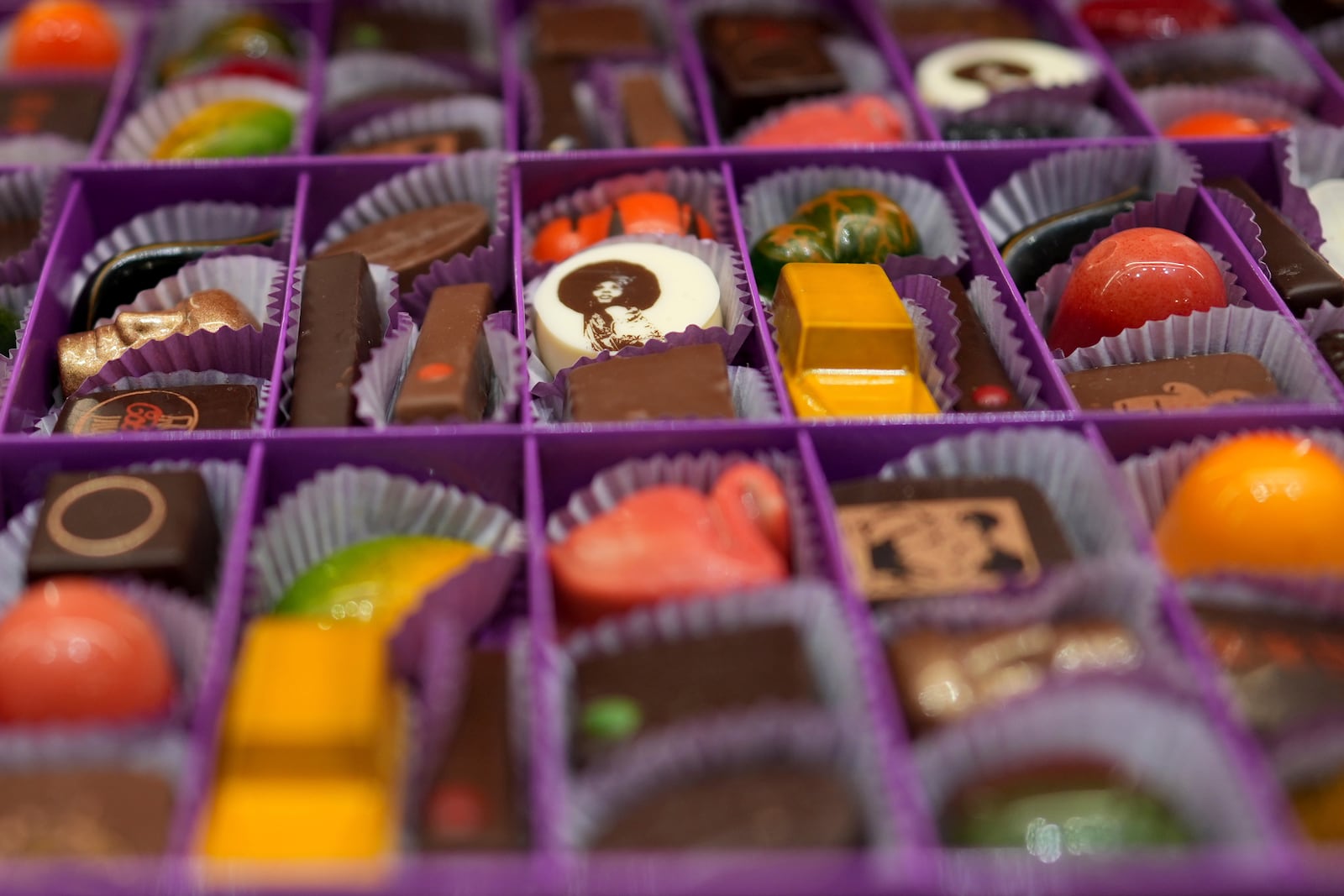 Artisan chocolates are displayed in a box at The Chocolate Line in Bruges, Belgium, Thursday, Feb. 6, 2025. (AP Photo/Virginia Mayo)