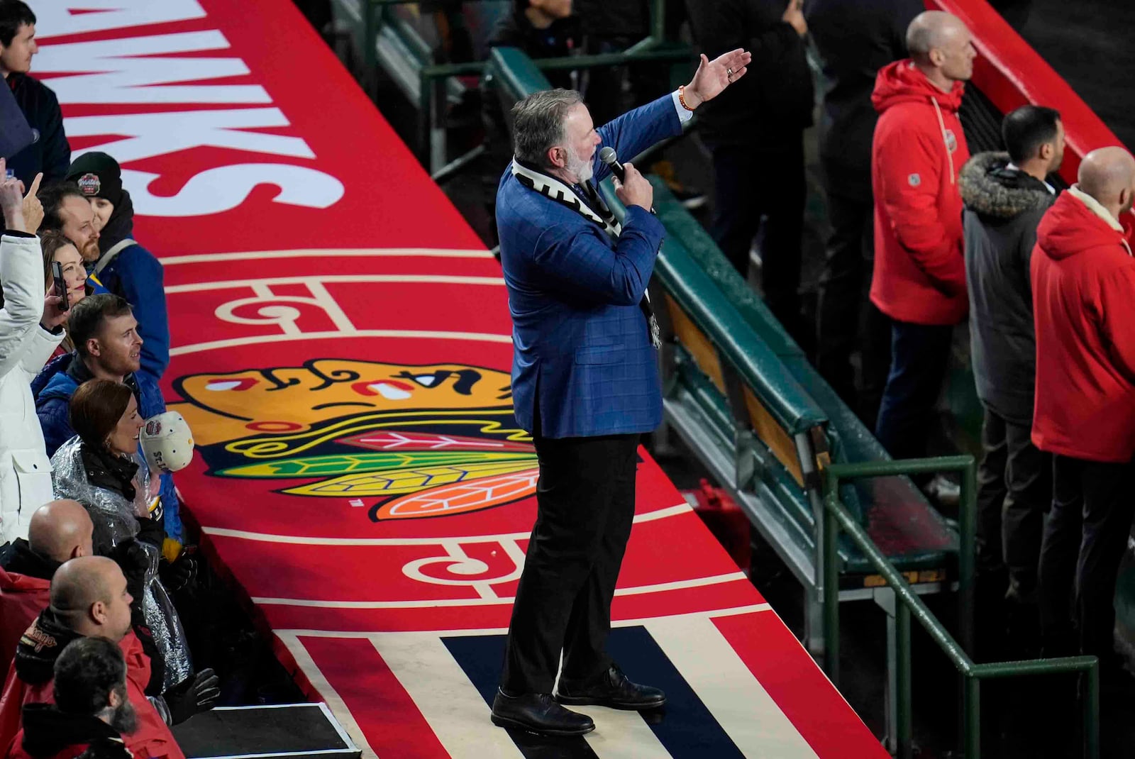 Chicago Blackhawks national anthem singer Jim Cornelison sings the Star-Spangled banner before the NHL Winter Classic outdoor hockey game featuring the Blackhawks and St. Louis Blues at Wrigley Field, Tuesday, Dec. 31, 2024, in Chicago. (AP Photo/Erin Hooley)