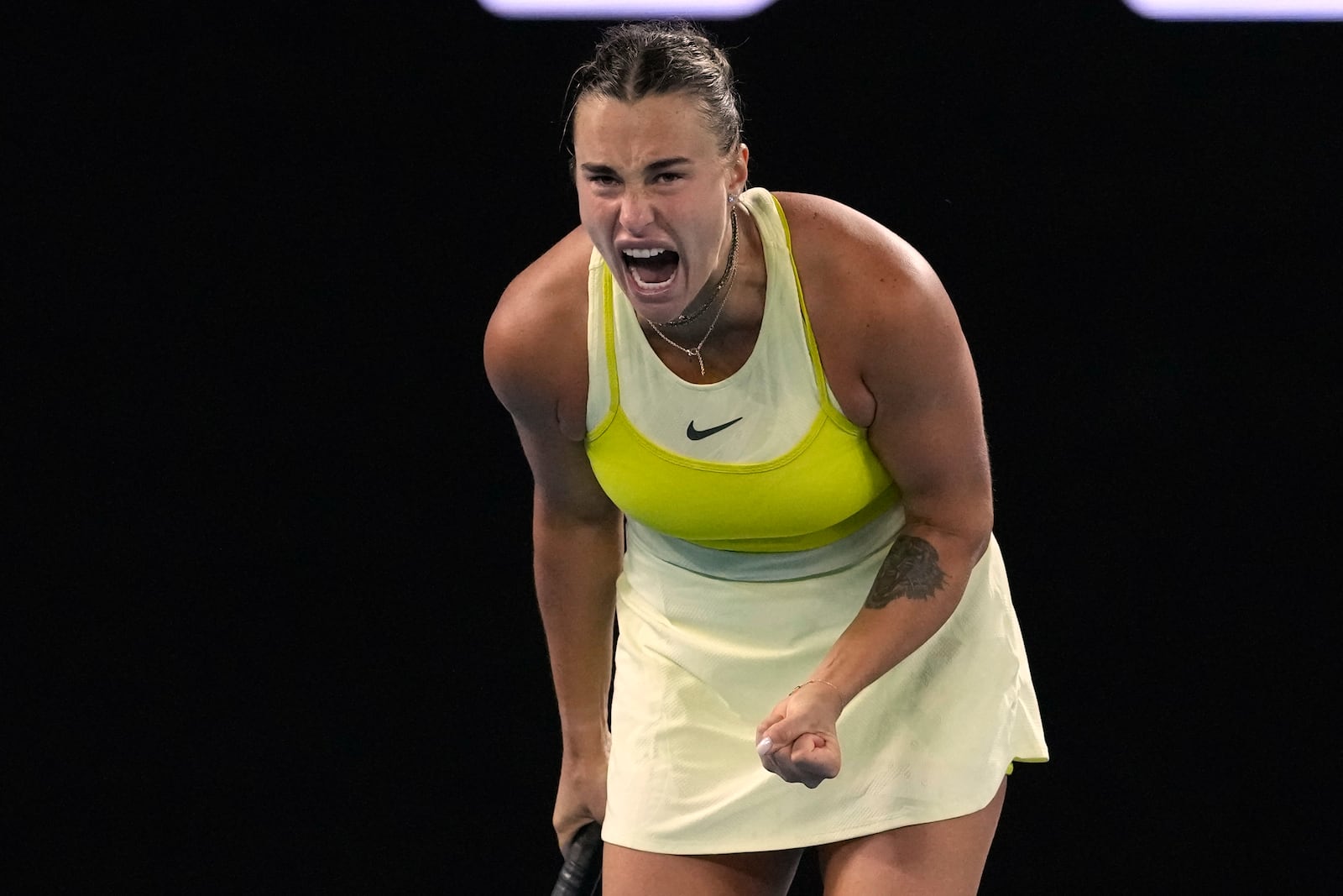 Aryna Sabalenka of Belarus reacts during her quarterfinal match against Anastasia Pavlyuchenkova of Russia during their quarterfinal match at the Australian Open tennis championship in Melbourne, Australia, Tuesday, Jan. 21, 2025. (AP Photo/Manish Swarup)