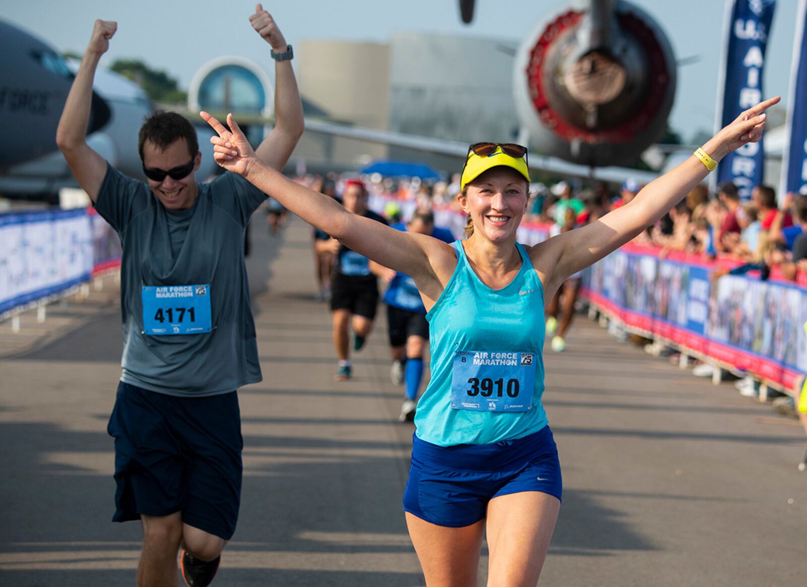 Maria Ruden and Joshua Latimer celebrate as they cross the finish line of the half-marathon last year at Wright-Patterson Air Force Base. U.S. AIR FORCE PHOTO/R.J. ORIEZ