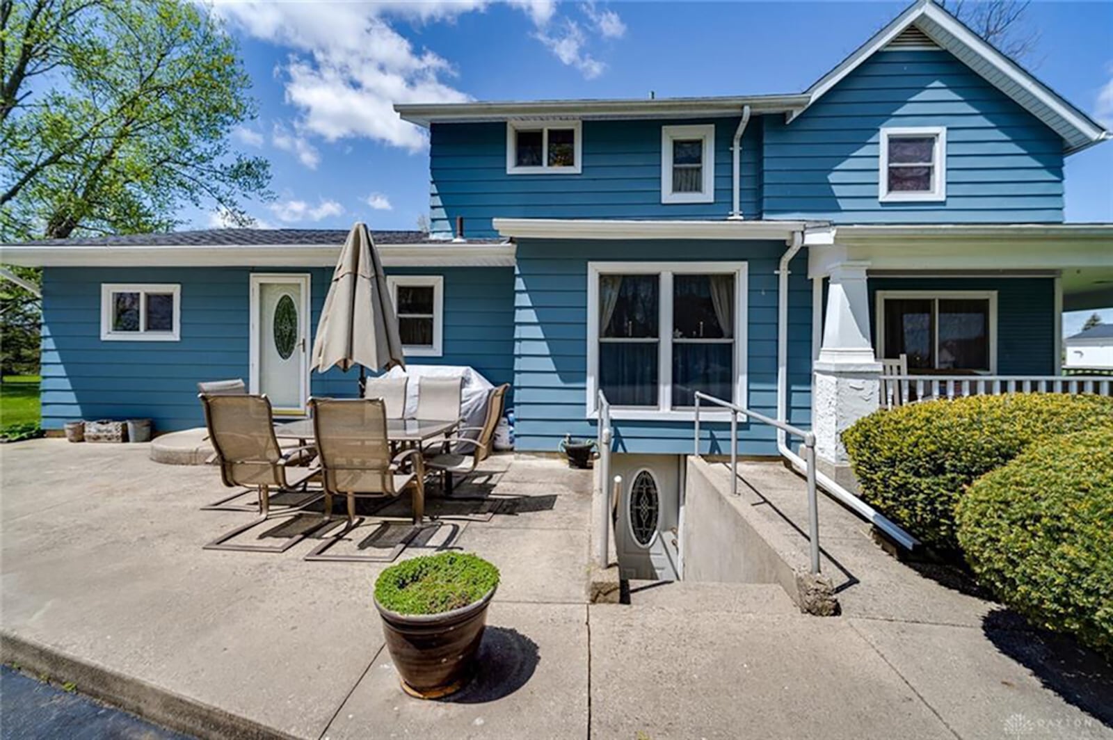 The rear of the home has a concrete patio and two exterior doors, including a door from the unfinished partial basement. There is also a 4-car, detached garage and above-ground pool with wood deck. CONTRIBUTED PHOTO