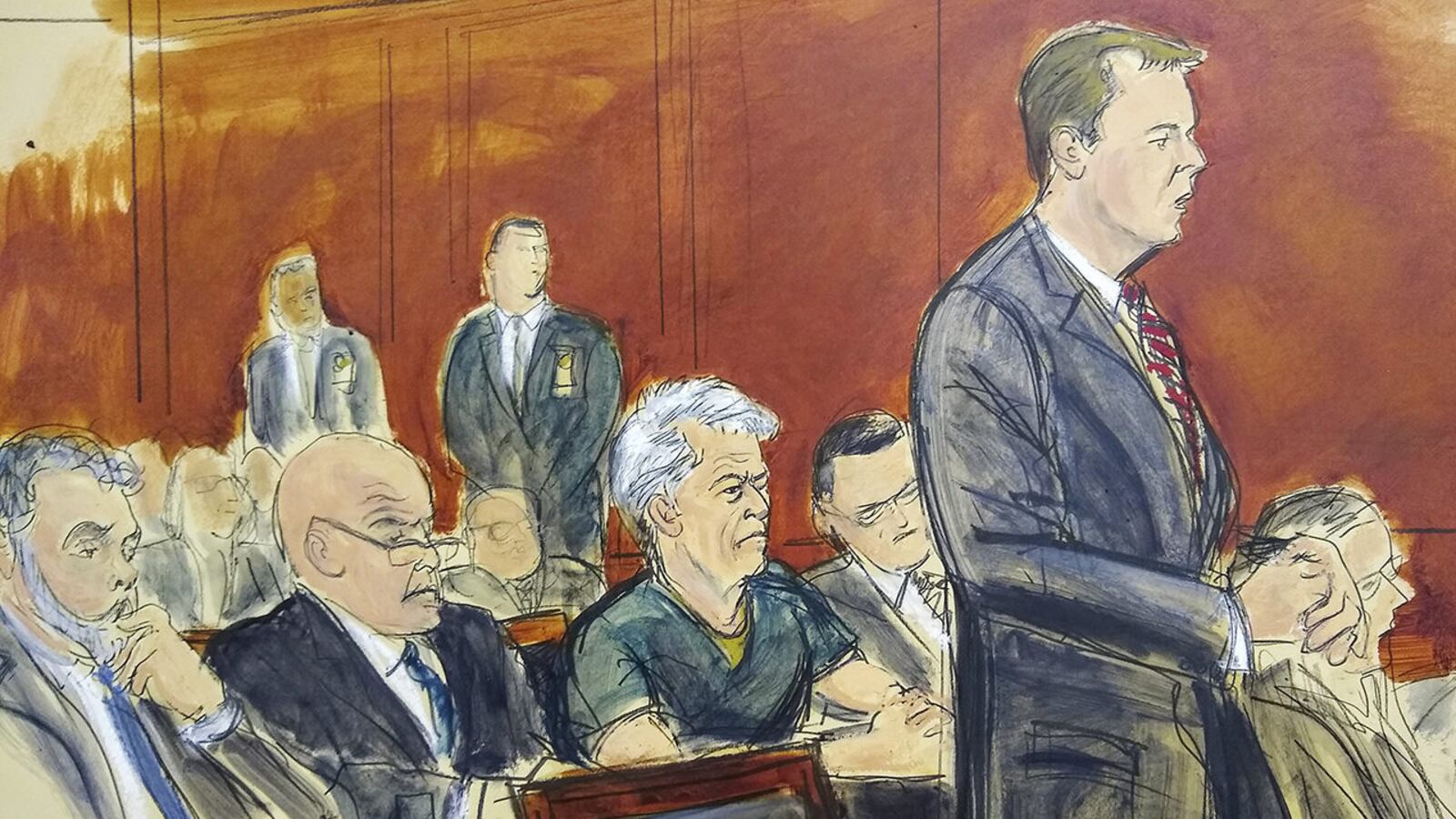 In this courtroom artist's sketch, defendant Jeffrey Epstein, center, listens as Assistant U.S. Attorney Alex Rossmiller, right, addresses the court during Epstein's arraignment, Monday, July 8, 2019 in New York.