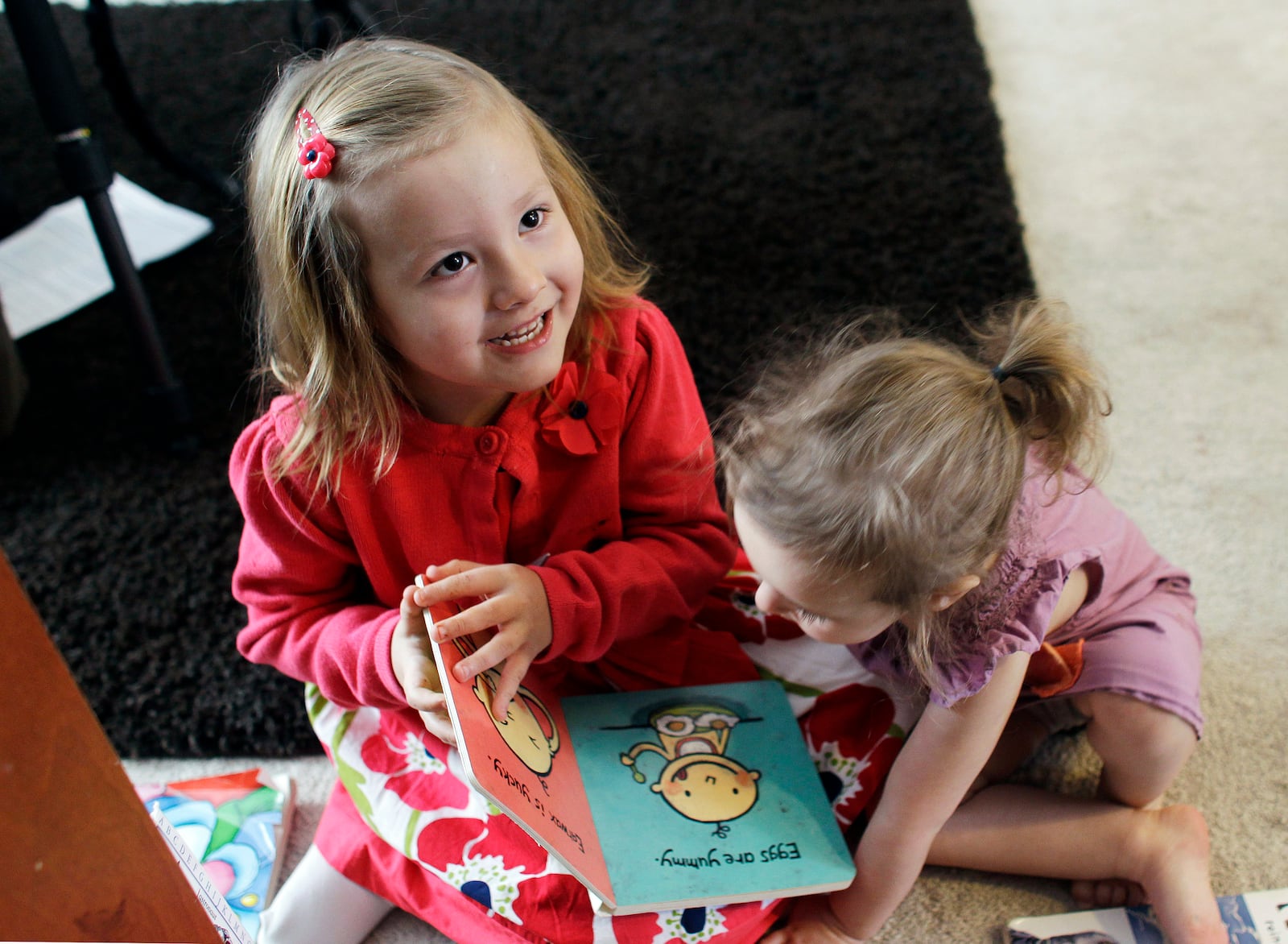 FILE - Coy Mathis, left, plays with her sister Auri, at their home in Fountain, Colo., on Monday, Feb. 25, 2013. Coy has been diagnosed with Gender Identity Disorder. Biologically, Coy, 6, is a boy, but to her family members and the world, Coy is a transgender girl. (AP Photo/Brennan Linsley, File)