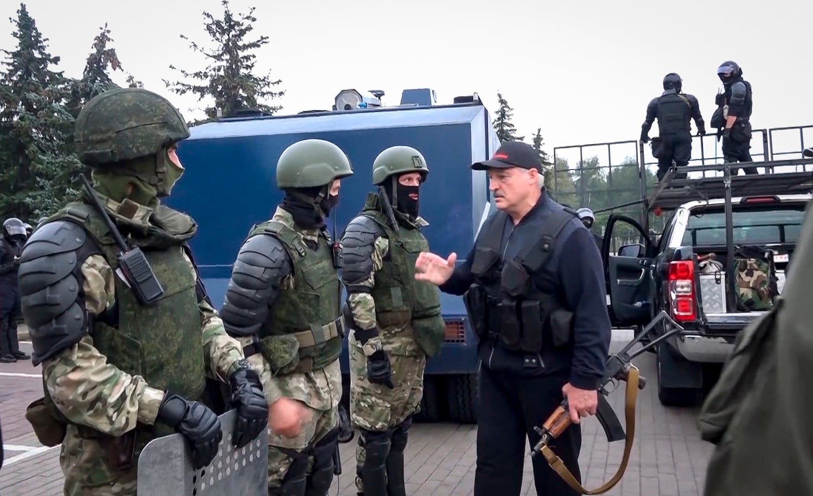 FILE - In this image made from video provided by the State TV and Radio Company of Belarus, President Alexander Lukashenko greets riot police officers near the Palace of Independence in Minsk, Belarus, on Aug. 23, 2020. (State TV and Radio Company of Belarus via AP, File)