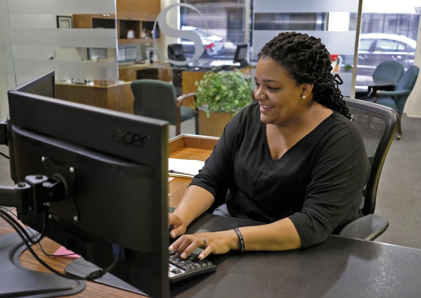 Michelle Thompson, a business banking representative at Security Bank, enters a clients data in the computer Friday. Clark State starts new banking major at college to fill the gap in the work force that’s growing as baby boomers retire from the banking industry in droves. BILL LACKEY/STAFF