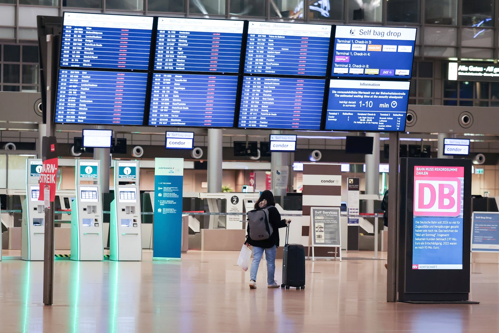 A display in Terminal 1 at Hamburg Airport, Germany shows that all departures have been canceled Monday, March 10, 2025. (Christian Charisius/dpa via AP)