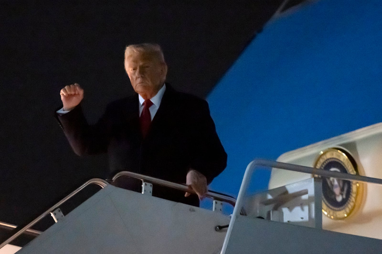 President Donald Trump walks from Air Force One after arriving at Joint Base Andrews, Md., Sunday, Feb. 9, 2025. (AP Photo/Ben Curtis)