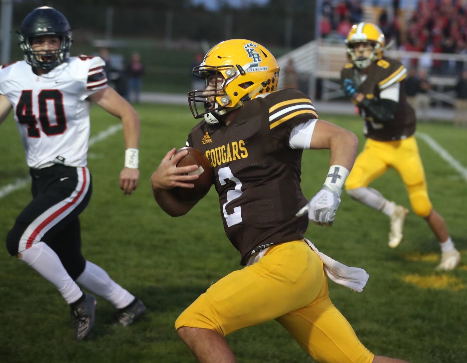 Kenton Ridge quarterback Dylan Lemen carries the ball against Jonathan Alder. BILL LACKEY/STAFF