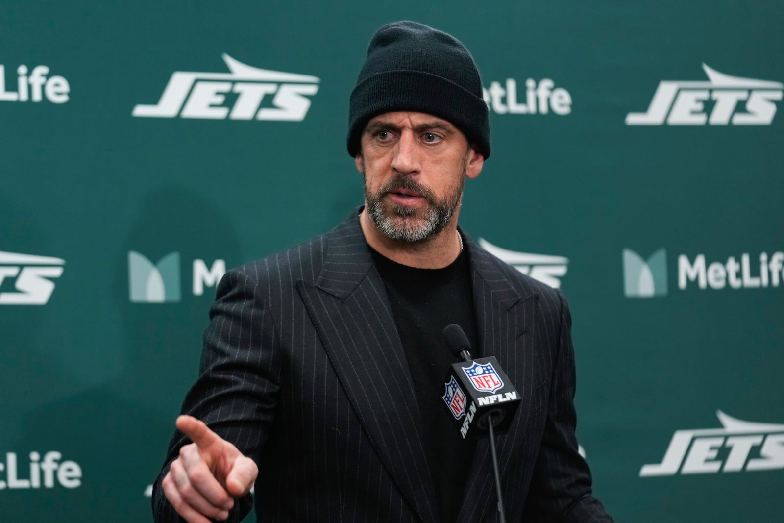 FILE - New York Jets quarterback Aaron Rodgers speaks at a news conference after an NFL football game against the Miami Dolphins, Sunday, Jan. 5, 2025, in East Rutherford, N.J. The Jets won 32-20. (AP Photo/Seth Wenig, File)