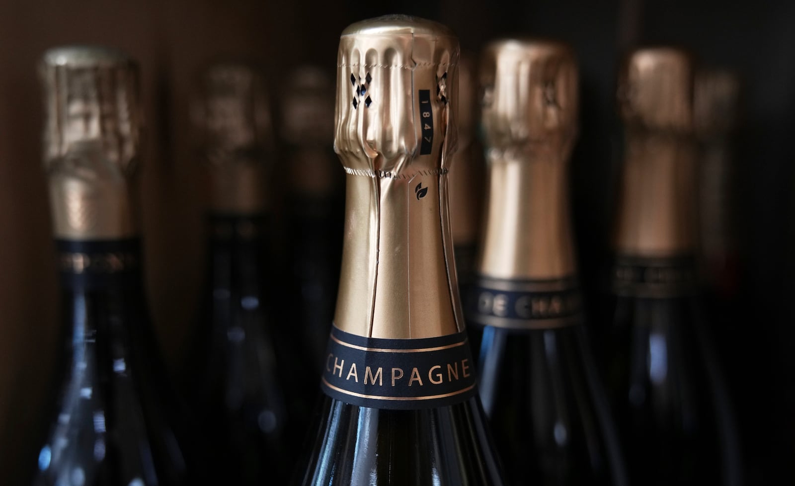 Bottles Champagne are for sale at a wine dealer shop as President Donald Trump threatened a 200% tariff on European wine, Champagne and spirits if the European Union goes forward with a planned tariff on American whiskey, Thursday, March 13, 2025 in Ville d'Avray, outside Paris. (AP Photo/Christophe Ena)