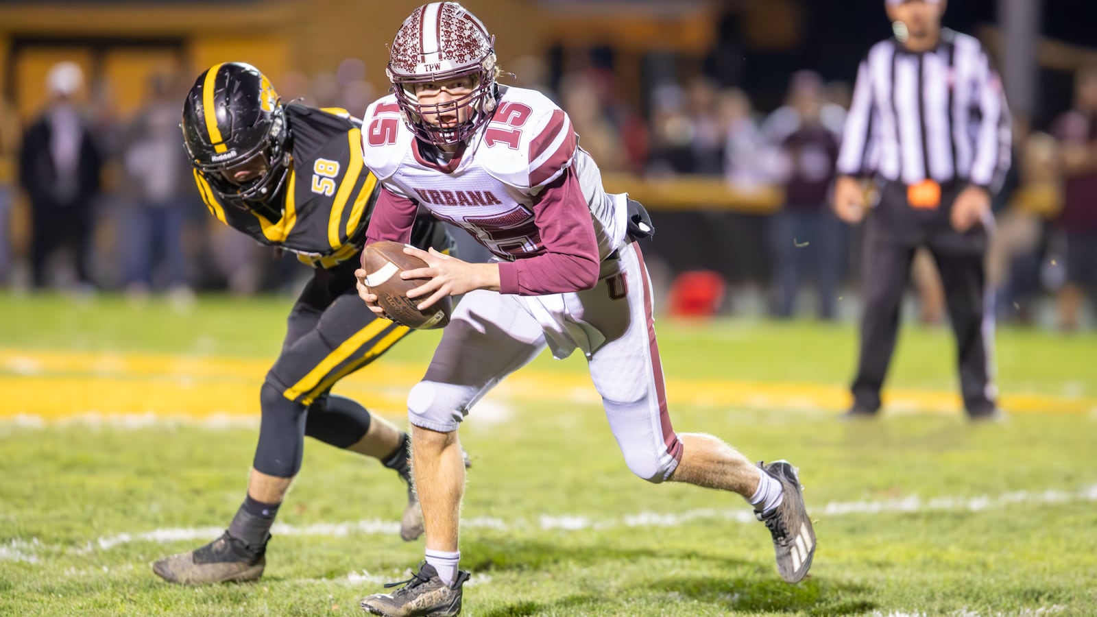 Urbana High School senior Will Donahoe escapes from Shawnee's Thomus Morgan during their game on Friday night in Springfield. The Braves won 42-7. Michael Cooper/CONTRIBUTED