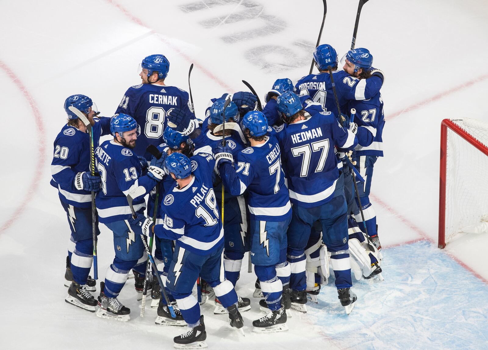 Tampa Bay Lightning celebrate a win over the New York Islanders during Game 2 of the NHL hockey Eastern Conference final, Wednesday, Sept. 9, 2020, in Edmonton, Alberta. (Jason Franson/The Canadian Press via AP)