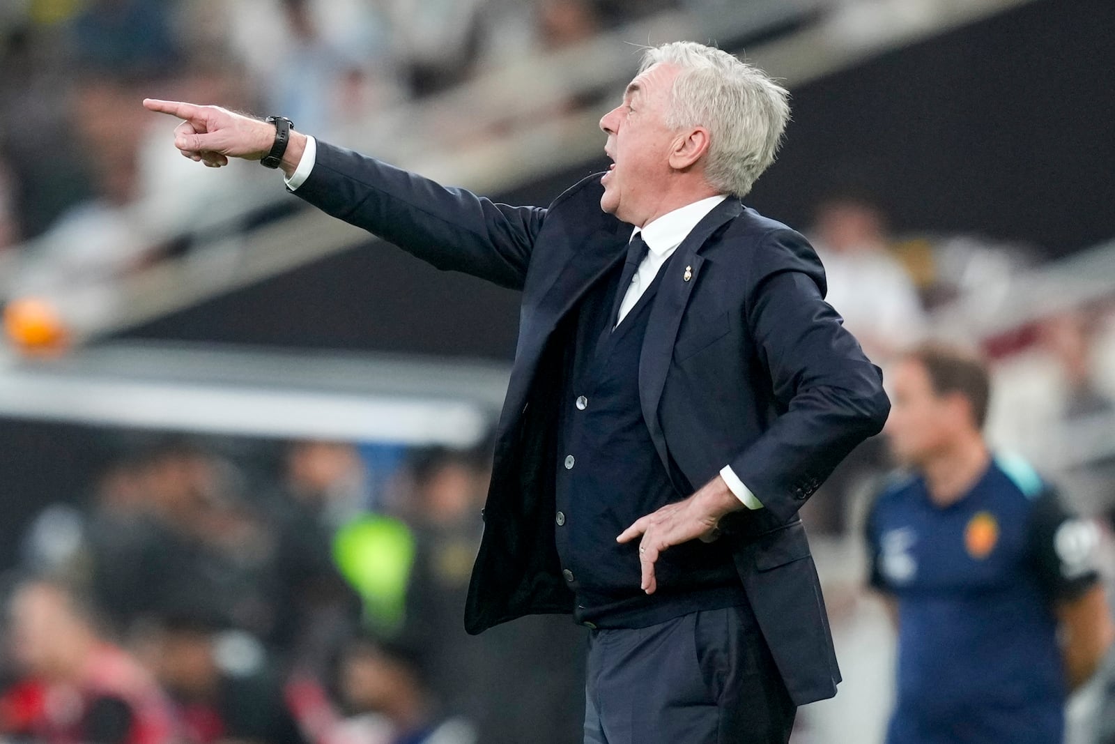 Real Madrid's head coach Carlo Ancelotti gestures during the Spanish Super Cup semifinal soccer match between Real Madrid and Mallorca at the King Abdullah Stadium in Jeddah, Saudi Arabia, Thursday, Jan. 9, 2025. (AP Photo/Altaf Qadri)