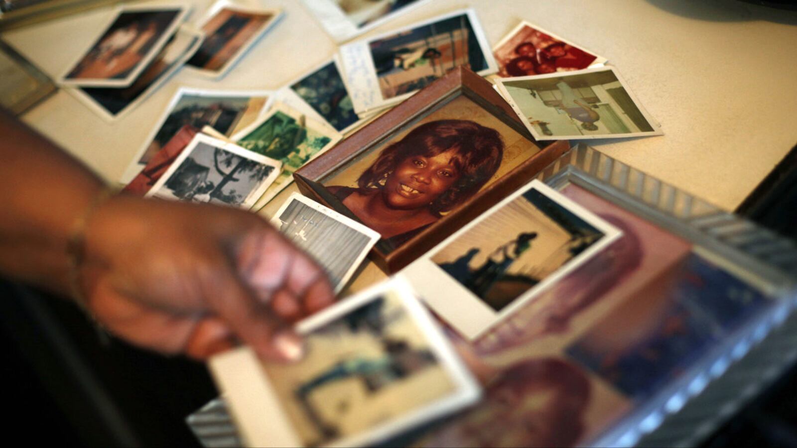 Brenda Gordon looks at photos of her mother, Carol Alford, at her apartment in Los Angeles in March 2013. Alford was a victim of Samuel Little, who has been named by the FBI as the most prolific serial killer in U.S. history.