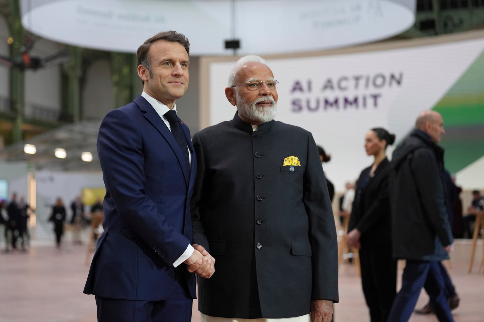 French President Emmanuel Macron, center left, poses with India's Prime Minister Narendra Modi at the Grand Palais during the Artificial Intelligence Action Summit in Paris, Tuesday, Feb. 11, 2025. (AP Photo/Aurelien Morissard)