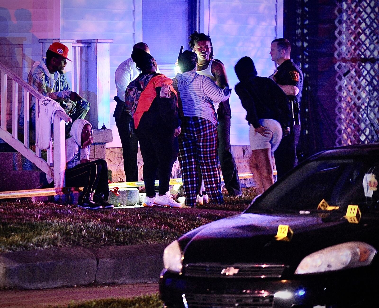 Residents are shown at the scene of mass shooting Sunday morning May 1, 2022. One person was fatally shot and four others were transported to hospitals with gunshot wounds.  MARSHALL GORBY \STAFF