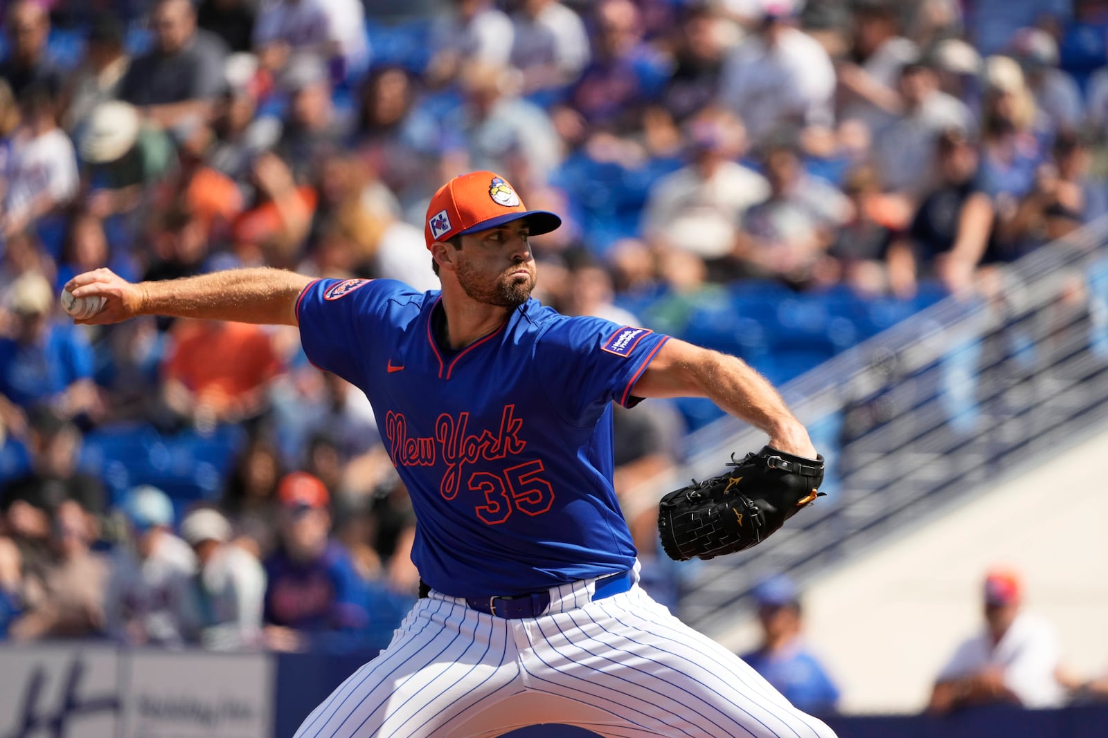 New York Mets starting pitcher Clay Holmes throws during the first inning of a spring training baseball game against the Houston Astros Saturday, Feb. 22, 2025, in Port St. Lucie, Fla. (AP Photo/Jeff Roberson)