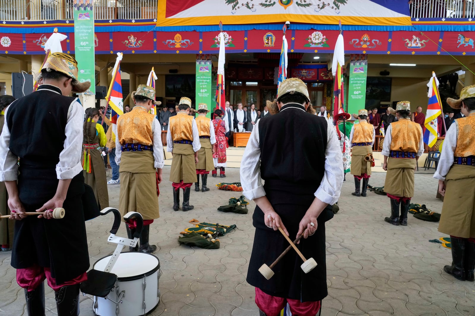 Exiled Tibetan artists observe a minute's silence as they mark the 66th anniversary of an uprising in Tibetan capital Lhasa, at the Tsuglakhang temple in Dharamshala, India, Monday, March 10, 2025. (AP Photo/Ashwini Bhatia)