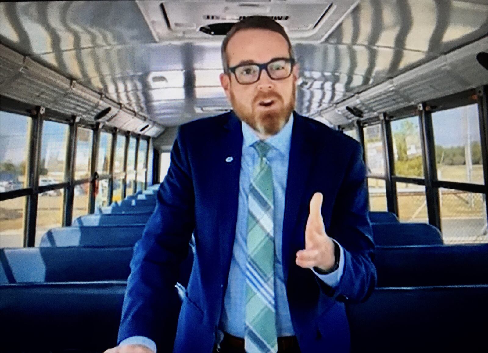 Prompted by last week’s announcement by Centers for Disease Control and Prevention (CDC) officials, removing a federal transportation department mask mandate in place since the beginning of the 2020 school year, area school buses now have an optional student mask policy. Mason Schools Superintendent Jonathan Cooper jumped on to an empty school bus to film a short video message to school families about his district's new policy. (Photo By Michael D. Clark\Journal-News)