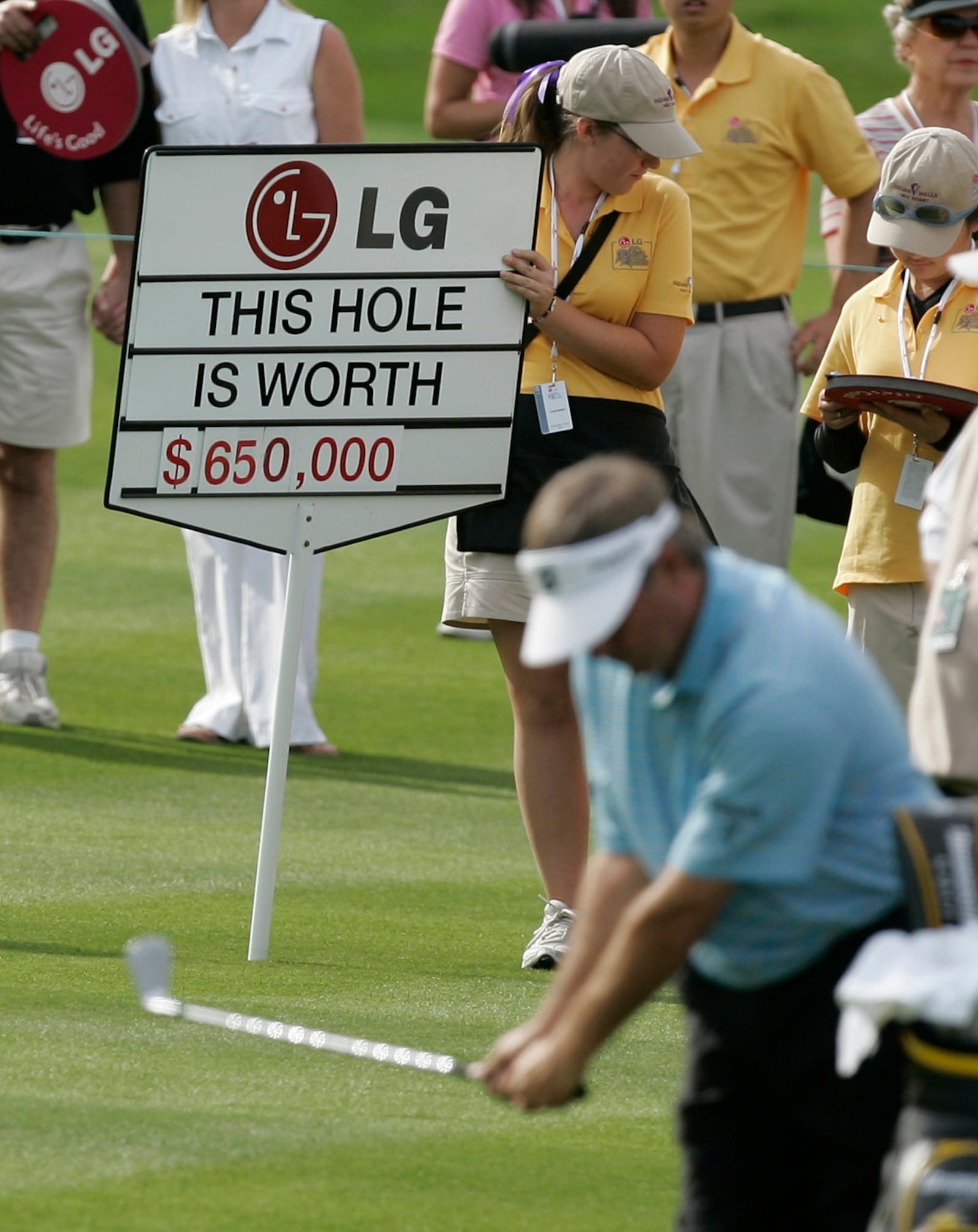 FILE - Fred Couples takes a practice swings in the 18th fairway, a hole worth US$650,000, during the Skins Game on the Celebrity course at Indian Wells Golf Resort in Indian Wells, Calif., Sunday, Nov. 25, 2007. Stephen Ames won the hole. (AP Photo/Chris Carlson, File)