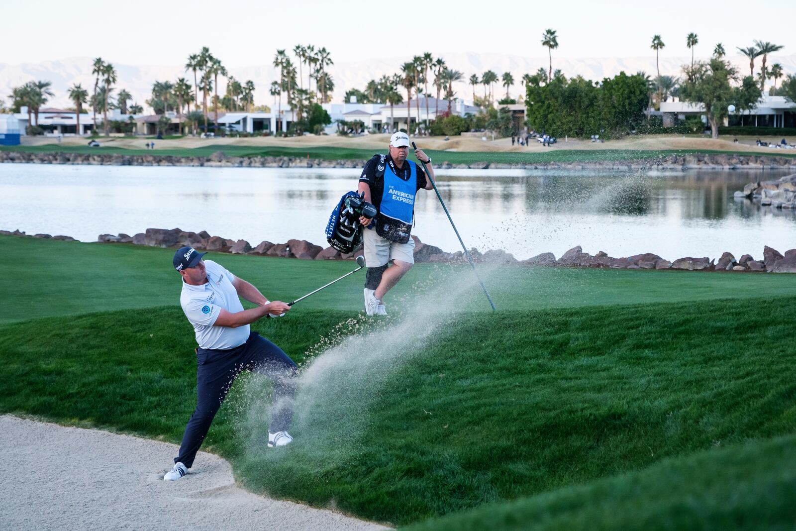 Sepp Straka hits from a bunker toward the 18th hole at the Pete Dye Stadium Course during the final round of the American Express golf tournament in La Quinta, Calif., Sunday, Jan. 19, 2025. (AP Photo/William Liang)