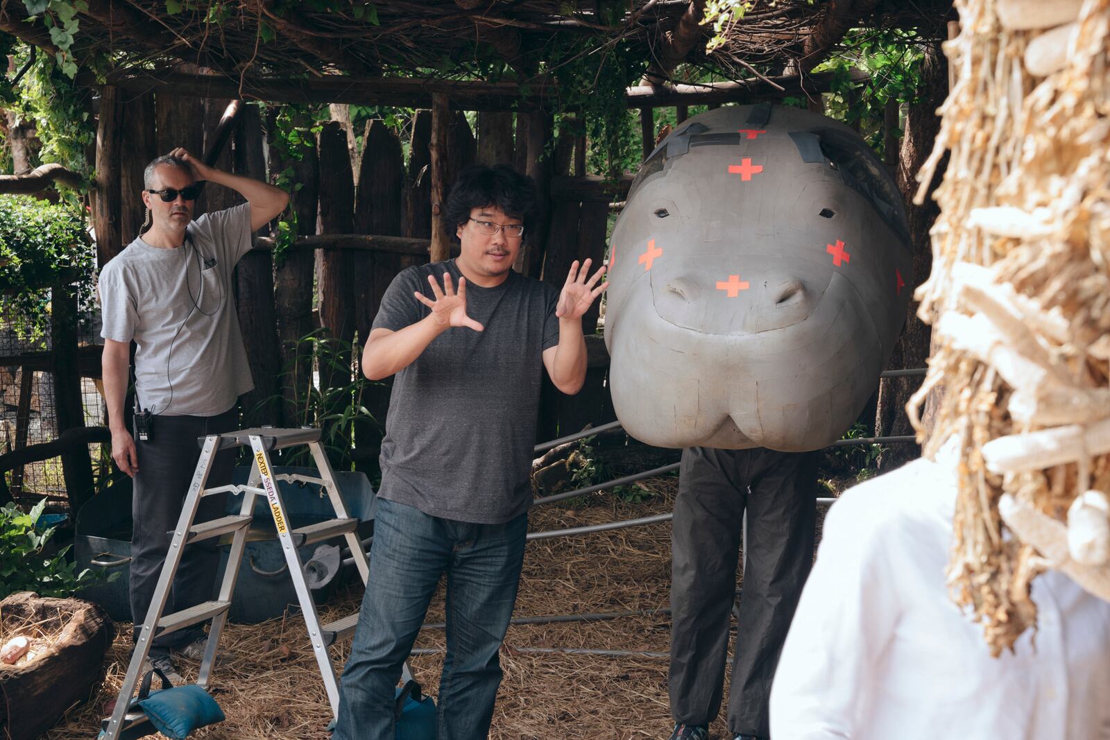 This 2017 image released by Netflix shows filmmaker Bong Joon Ho on the set of "Okja," part of the "Director's Inspiration Bong Joon Ho" exhibit opening in March at the Academy Museum in Los Angeles. (Lee Jaehyuk/Netflix via AP)