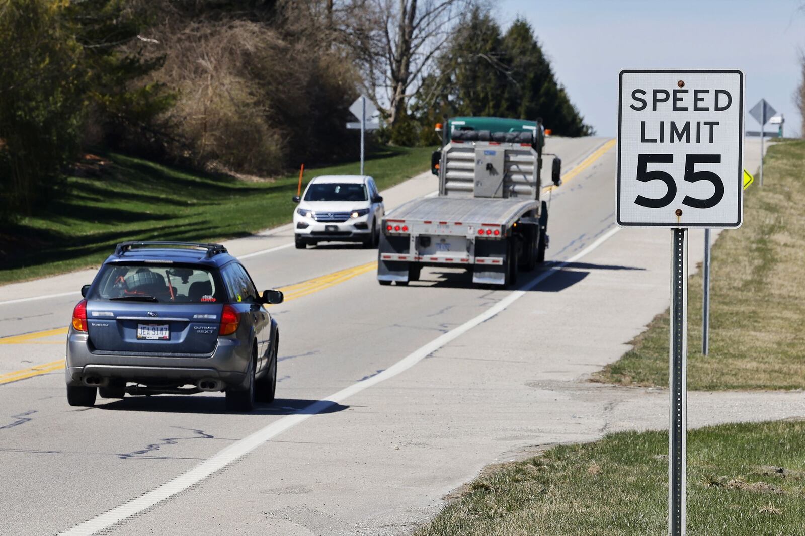 The speed limit is 55 mph on portions of Ohio 73 in Clearcreek Twp., Warren County. The Ohio Senate is considering an amendment to the new state transportation budget bill to increase speed limits on two lane U.S., state and county highways from 55 mph to 60 mph as well as increasing speed limits on such highways to 65 mph with an engineering study. NICK GRAHAM/STAFF