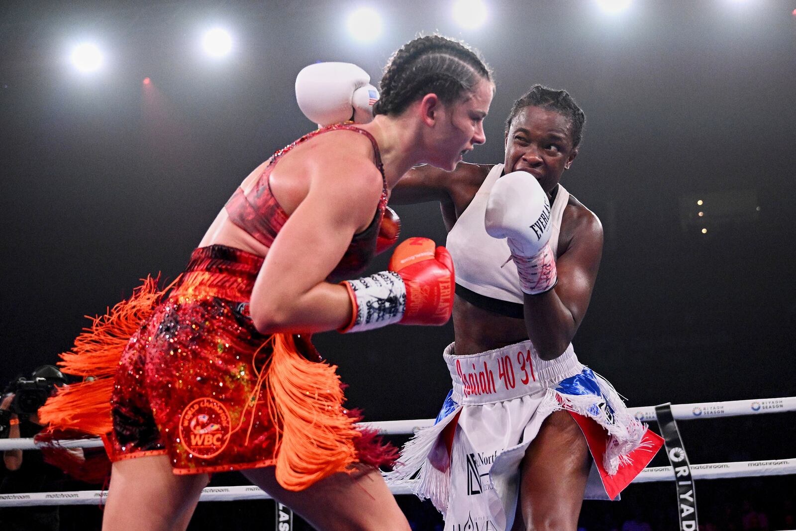 Former US police officer Tiara Brown, right, battles Skye Nicolson, of Australia, for the WBC world featherweight title at Qudos Bank Arena in Sydney, Saturday, March 22, 2025. (Dan Himbrechts/AAP Image via AP)