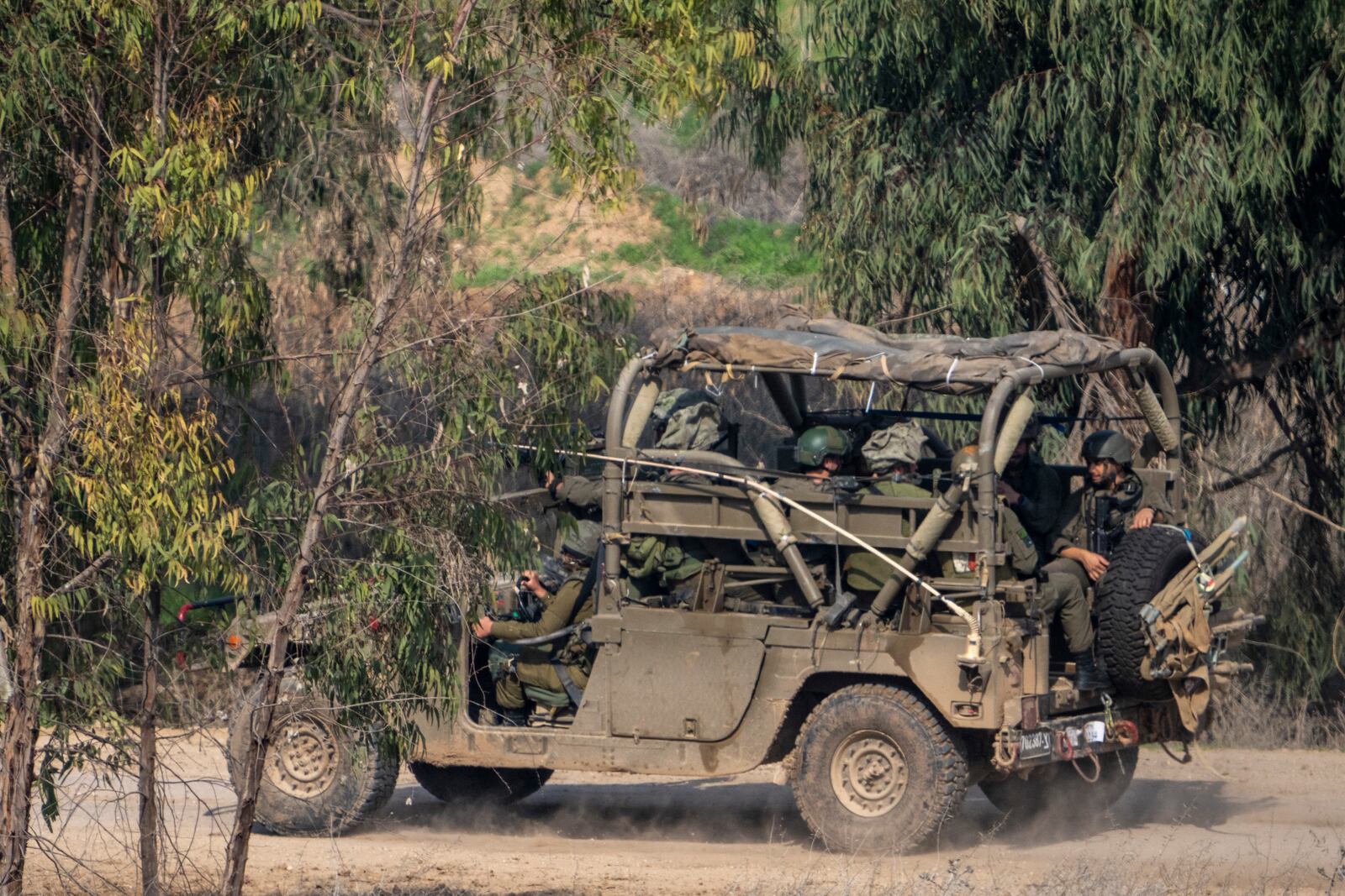 FILE - Israeli soldiers drive near the northern Gaza Strip border in southern Israel, Tuesday, Jan. 28, 2025. (AP Photo/Ariel Schalit, File)