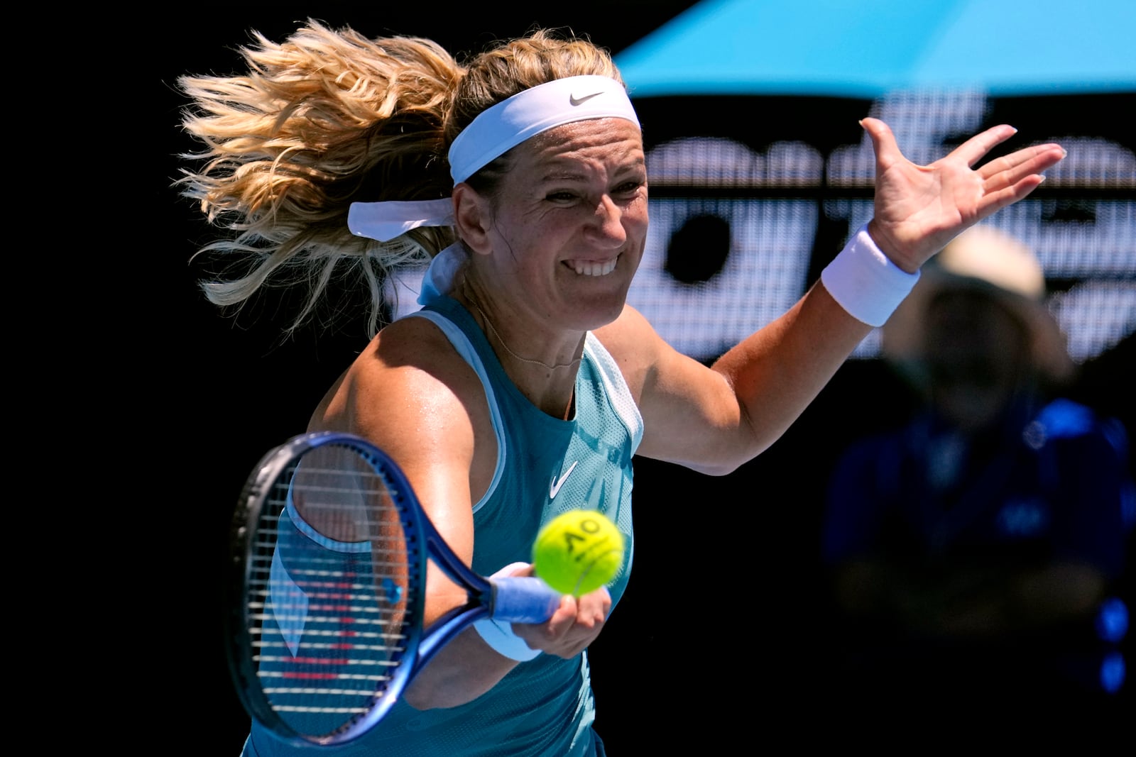 FILE - Victoria Azarenka of Belarus plays a forehand return to Lucia Bronzetti of Italy during their first round match at the Australian Open tennis championship in Melbourne, Australia, Jan. 13, 2025. (AP Photo/Vincent Thian, File)