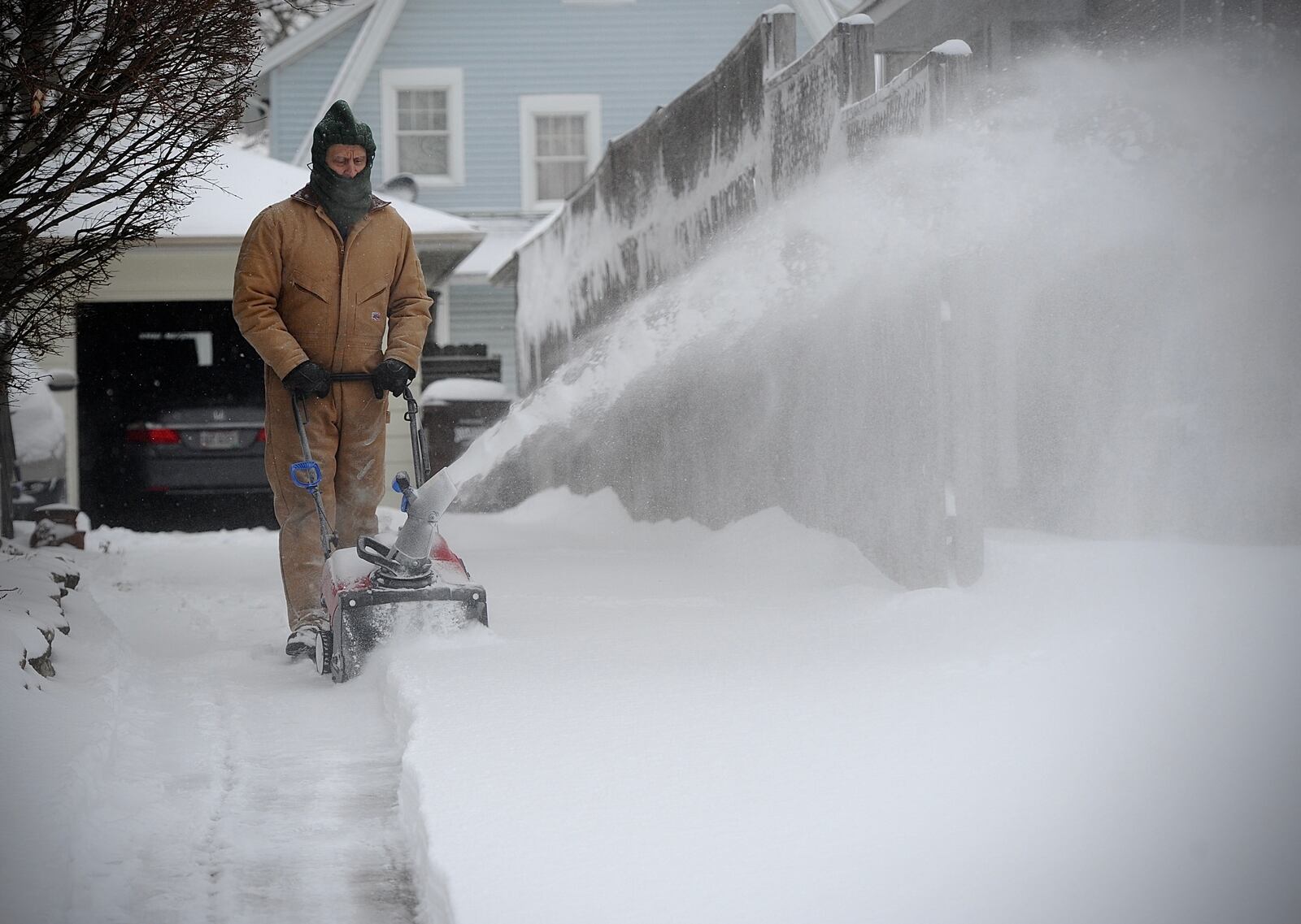 Dave Pressler was hard at work blowing the snow from his driveway on Third Street in Springfield Friday morning February 4, 2022.