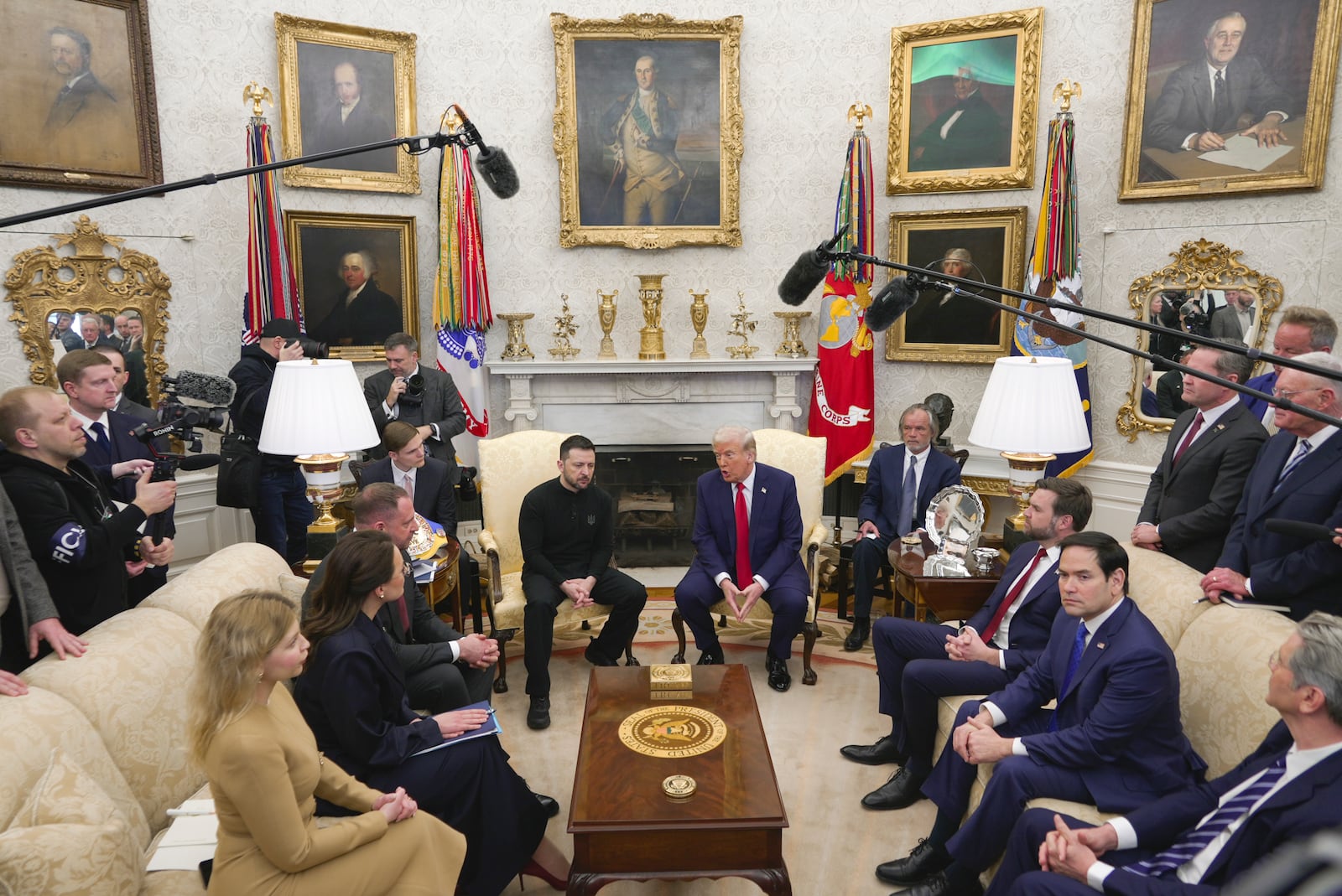 President Donald Trump, center right, meets with Ukrainian President Volodymyr Zelenskyy, center left, as Secretary of State Marco Rubio, seated from second right, and Vice President JD Vance listen at the Oval Office at the White House, Friday, Feb. 28, 2025, in Washington, . (AP Photo/ Mystyslav Chernov)