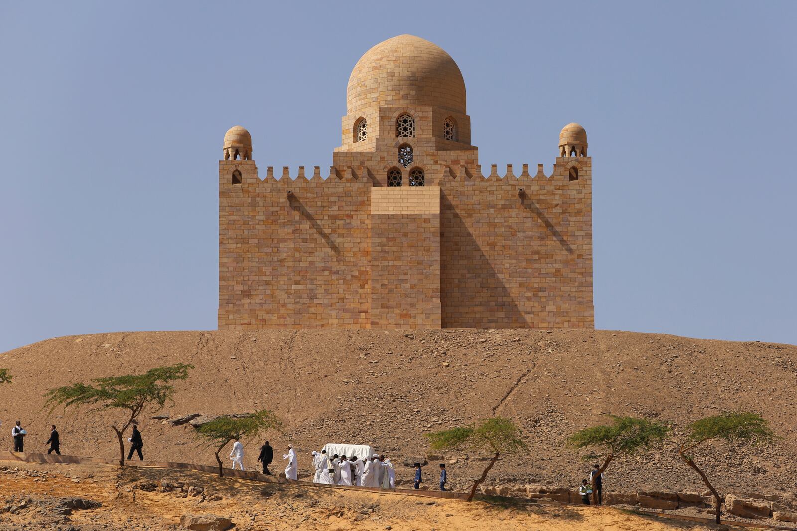 People carry the coffin of Prince Karim Al-Hussaini, the Aga Khan IV and 49th hereditary imam of the Shiite Ismaili Muslims, who died Tuesday in Portugal, to be buried at the Aga Khan mausoleum, in Aswan, Egypt, Sunday, Feb. 9, 2025. (AP Photo/Haytham Fahmy)