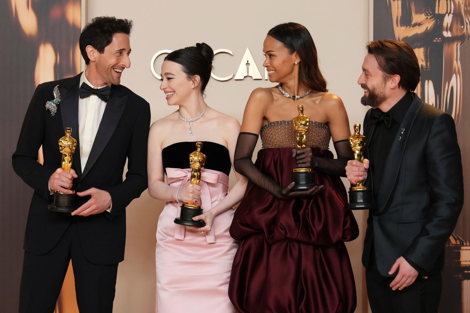 Adrien Brody, from left, winner of the award for best performance by an actor in a leading role for "The Brutalist," Mikey Madison, winner of the award for best performance by an actress in a leading role for "Anora," Zoe Saldana, winner of the award for best performance by an actress in a supporting role for "Emilia Perez," and Kieran Culkin, winner of the award for best performance by an actor in a supporting role for "A Real Pain," pose in the press room at the Oscars on Sunday, March 2, 2025, at the Dolby Theatre in Los Angeles. (Photo by Jordan Strauss/Invision/AP)