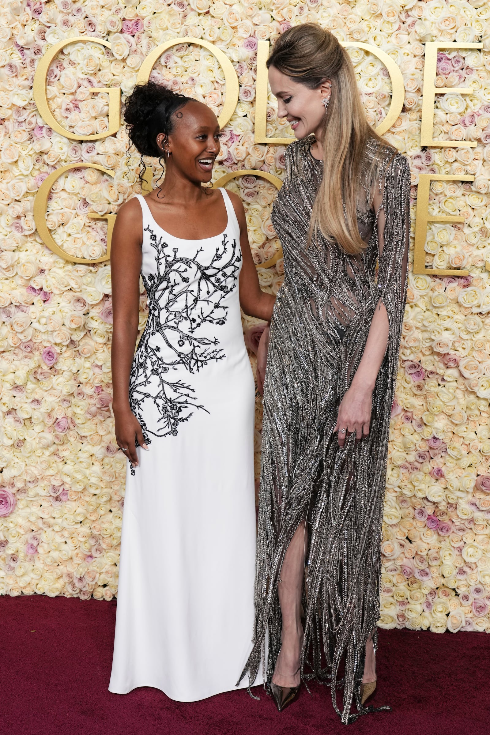 Zahara Jolie, left, and Angelina Jolie arrive at the 82nd Golden Globes on Sunday, Jan. 5, 2025, at the Beverly Hilton in Beverly Hills, Calif. (Photo by Jordan Strauss/Invision/AP)